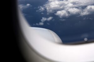 Airplane window view clouds
