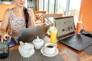Digital nomad working remotely with laptop